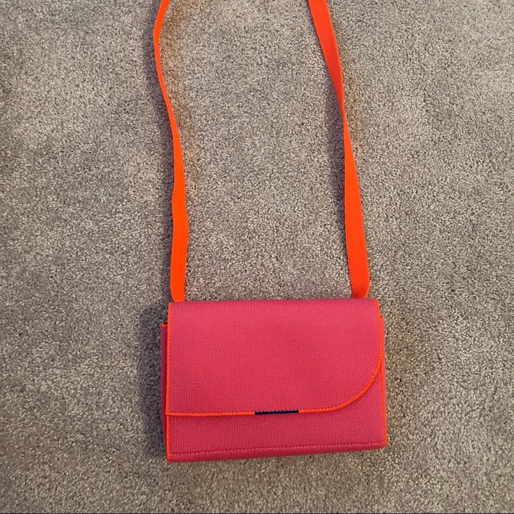 Rothy’s hot pink belt bag